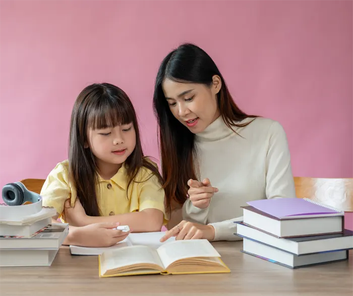 kind-asian-female-teacher-helps